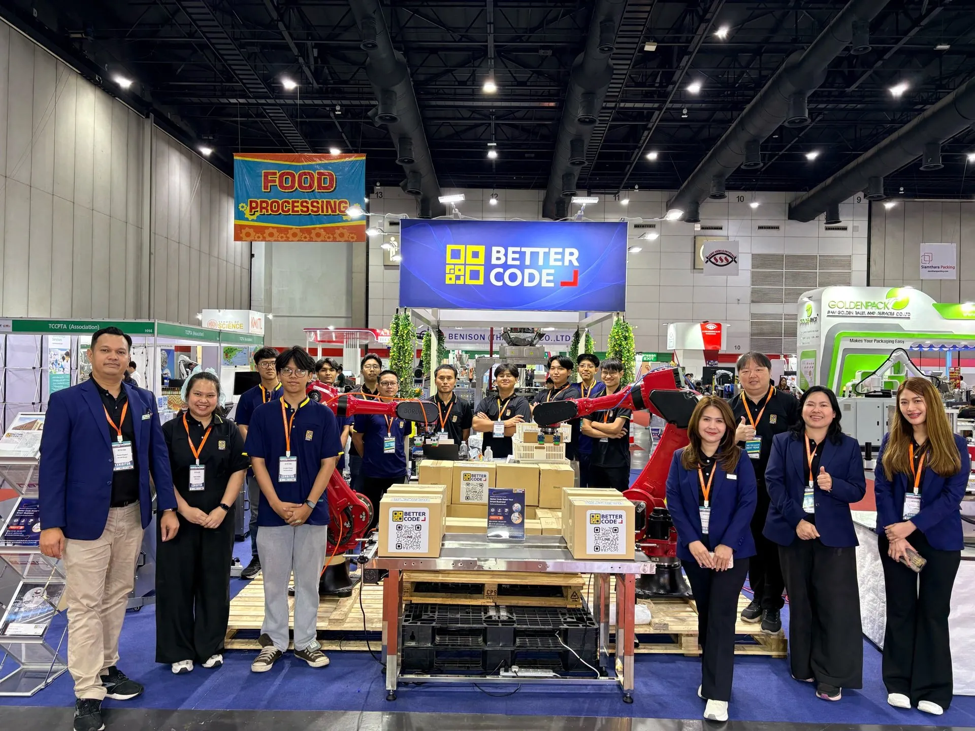 Better Code team with robot and case-palletizing demonstration equipment at Food Pack 2026